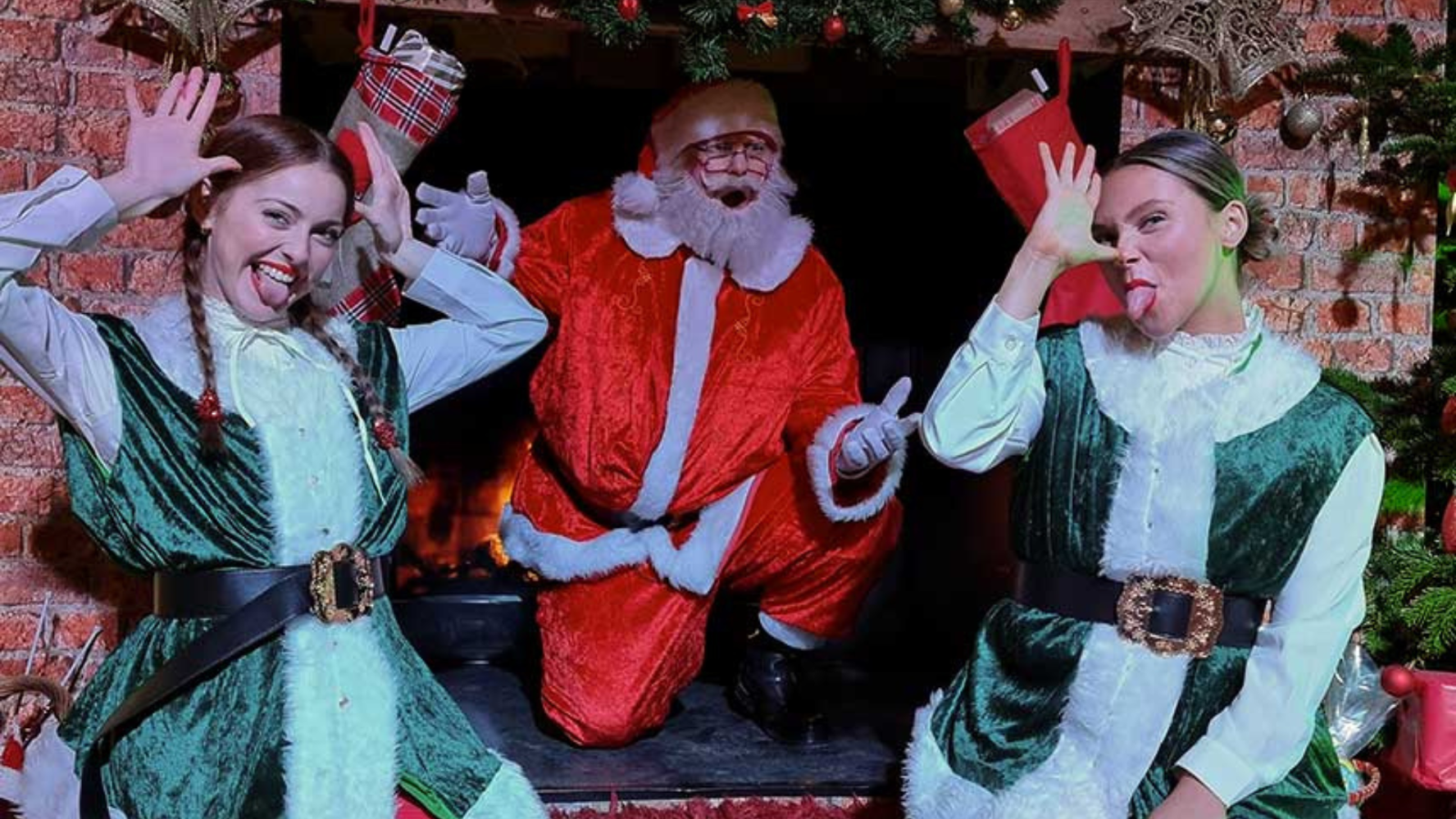 Two elves with Santa